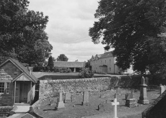 View of churchyard and former Manse from NW.