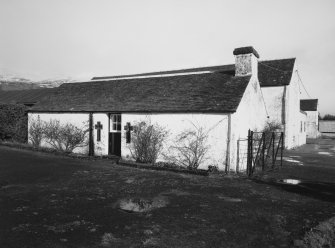 View of estate office from SW, showing cruciform windows.