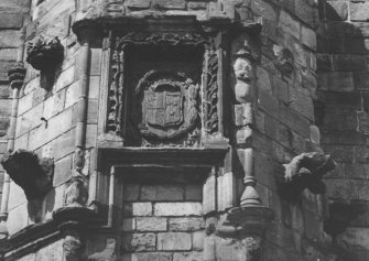 View of heraldic panel to right of entrance.