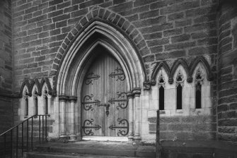 Detail of E door and flanking windows.