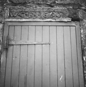 Detail of inscribed lintel over doorway.