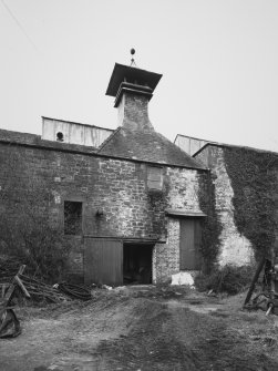 View of former kiln at centre of farm buildings (former distillery) from SE.