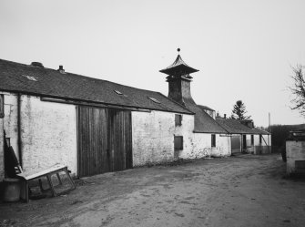 View from N of central part of main block of farm buildings, including former distillery kiln.
