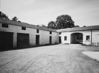 General view of stables' W and S ranges from NE.