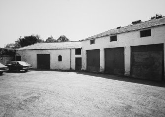 View of stables' S and E ranges from N.