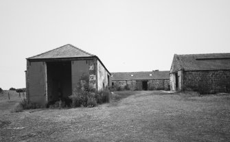 View of steading buildings adjacent to farmhouse from NE.