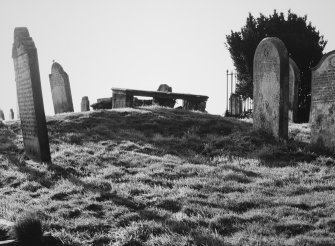 View of burial ground, showing table tomb.