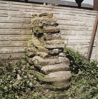 Detail of base of pier incorporated into W buttress on S side of dutch barn in Kirkstyle steading.