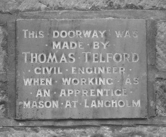 Detail of inscription on gateway; "THIS DOORWAY WAS MADE BY THOMAS TELFORD CIVIL ENGINEER WHEN WORKING AS AN APPRENTICE MASON AT LANGHOLM"