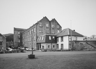 General view from NNE of the NE end of the works, showing the High Mill and adjacent offices.