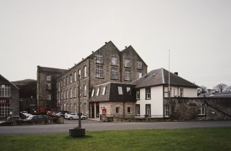 General view from NNE of the NE end of the works, showing the High Mill and adjacent offices.