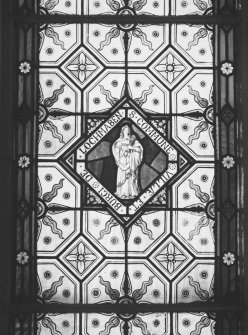 Interior.
First floor, hall, SW stained glass window, detail of S panel.