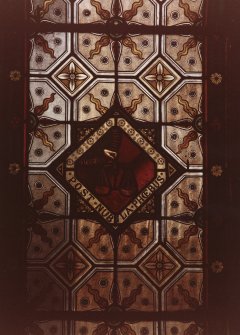 Interior.
First floor, hall, detail of SW stained glass window, S panel.