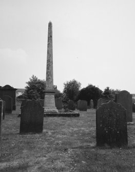 View of obelisk in churchyard from W.