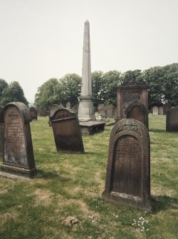 View of obelisk in churchyard from NE.