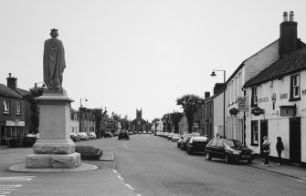 View showing setting in High Street from N