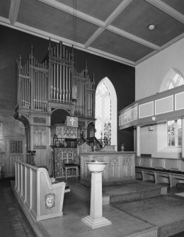 Interior. View ofplatform showing organ, communion table, font and eler's seats