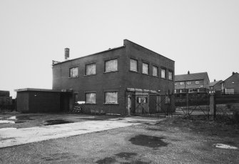 View from E of former office building (now disused) at NW corner of site