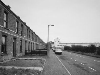 General view past Newbie Cottages (from SW) of main entrance to works