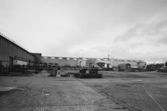 General view from SE along NE side of Bay 7 [Heavy Fabrication Finishing & Testing], across yard towards Bay 5 [Machining & General Stores] and 6 [Maintenance Dep't]