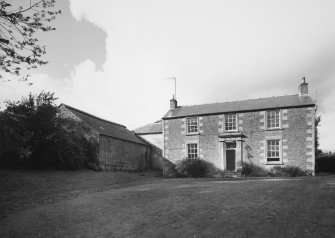 View from E of frontage of farmhouse (right), and rear of adjacent cattle shed (left)