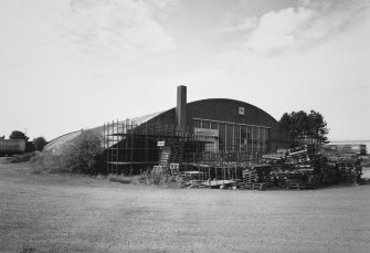 Oblique view from ENE of hangar, showing ESE side and NNE end of building		