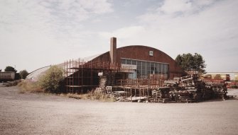 Oblique view from ENE of hangar, showing ESE side and NNE end of building		