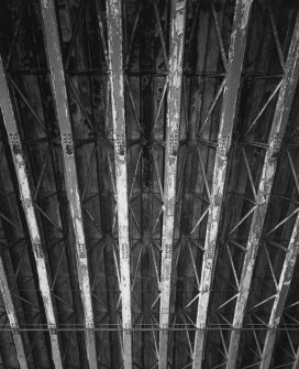 Interior.
Detailed view of typical portion of lattice-steel girders with raking angle-section steel struts supporting steel outer shell of hangar.