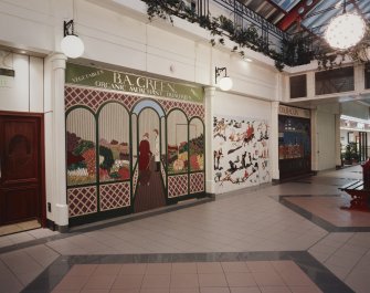 Interior.
View of colourful painted facades on unoccupied shops.
