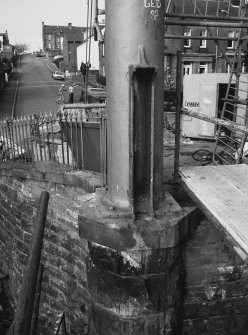 View of base of column at SW end of suspension footbridge.