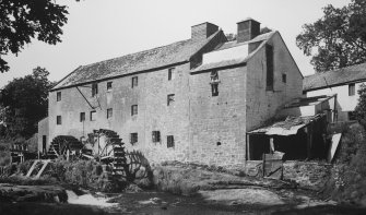 View from S showing mill wheels, sluice gates and part of weir.