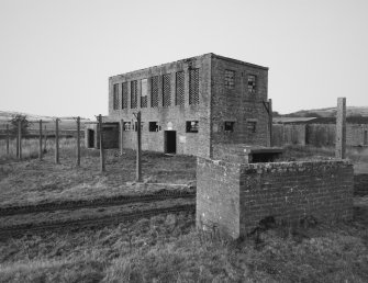 View.  Acetone Recovery House (broad), (building 243) from E.