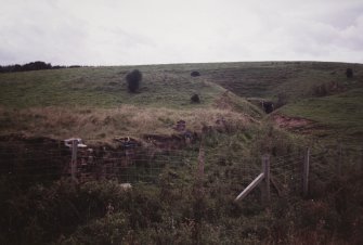 View.  Entrance to underground magazine with a second in the foreground at S end of site.