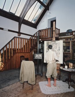 Interior, view of studio from West Interior, showing bookcases, entrance staircase and manequin representing Hornel at work