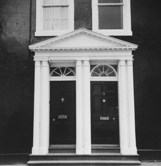 Detail of pedimented double doorway.