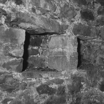 Interior.
Ground floor, base of tower, east internal wall, detail of aumbries.