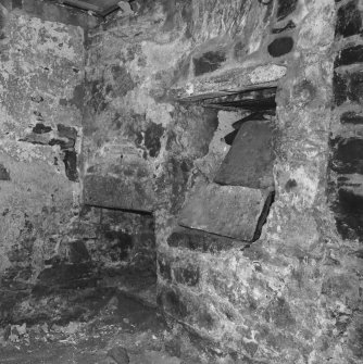 Ground floor, detail of blocked opening and fireplace