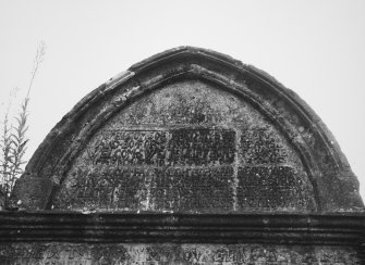 Detail of upper moulded arch with inscription.