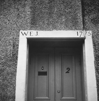 Detail of inscribed doorway lintel.