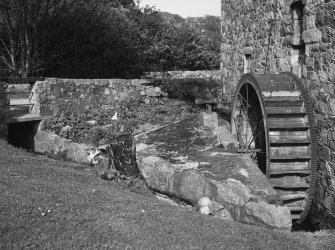 Detail of threshing barn waterwheel and lade.