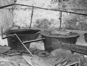 Interior.
Detail of cast iron tubs with wooden covers.