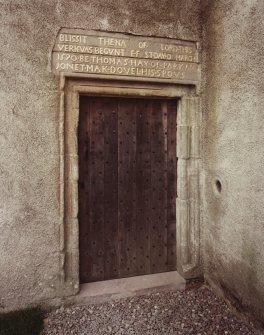 Detail of door with inscription above.