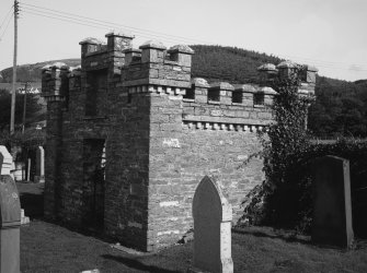 View of burial vault in graveyard.