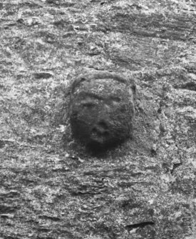 Detail of carved mask on W elevation.