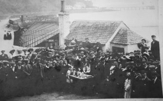 View showing crowd gathered for awards presentation.

