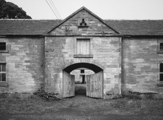 Steading entrance, with doors half closed, from South West