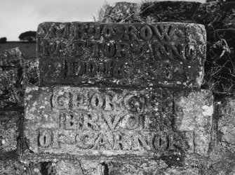 Carved stones built into North wall of church