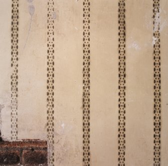 Room 7, detail of stencilled wall decoration (vertical stripes consisting of a geometric pattern)