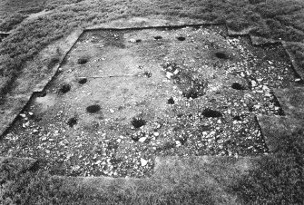 View of excavation showing the whole site with postholes with stones removed