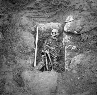 View of Cist 3 with inhumation butrial in situ.